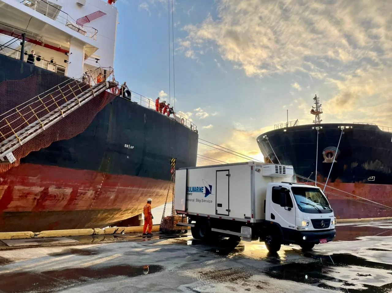 Sul Marine refrigerated truck supplying a vessel in port at sunset
